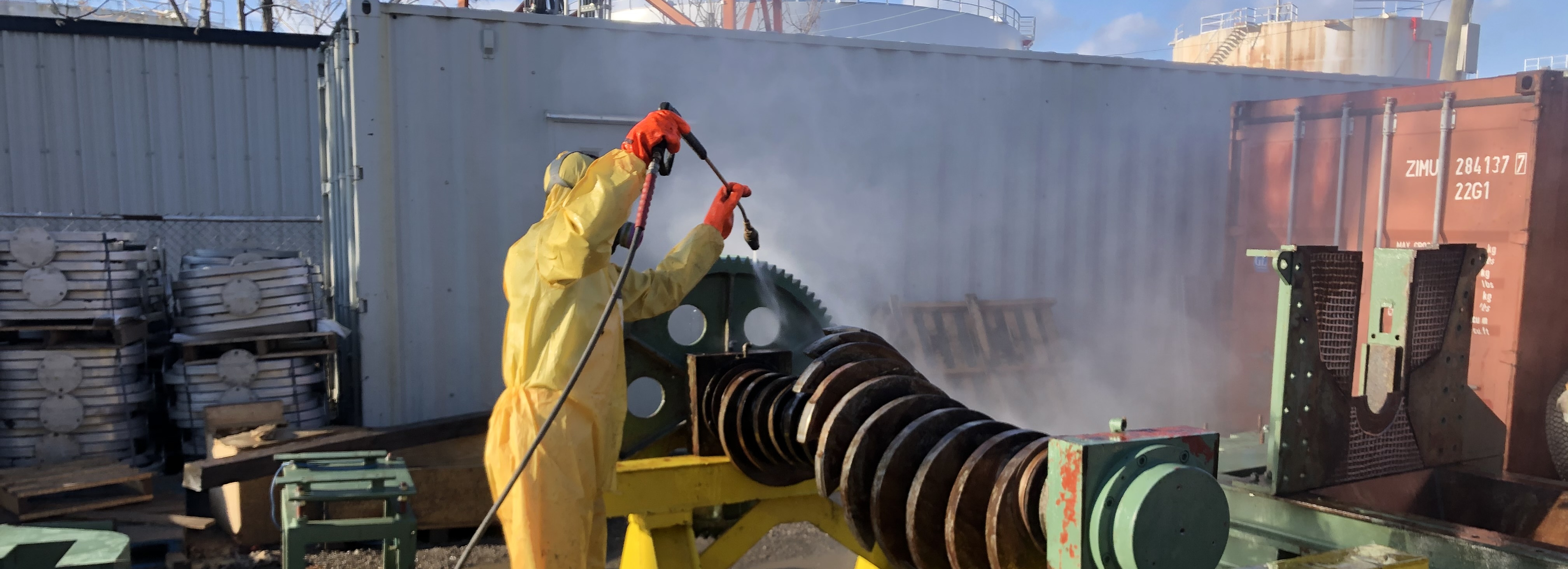 Industrial equipment being pressure washed on site