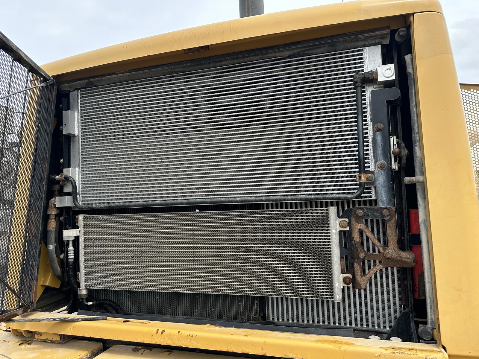 Close-up of a heavy equipment radiator and cooling fins